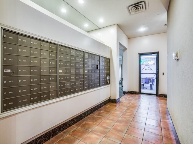view of home's community with mail area and visible vents