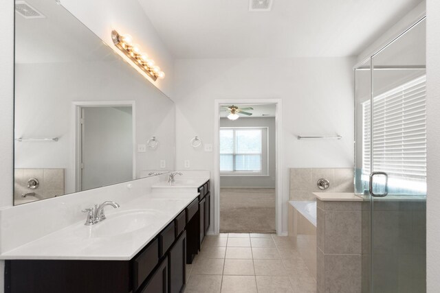 full bath featuring a bath, ceiling fan, tile patterned flooring, and a sink
