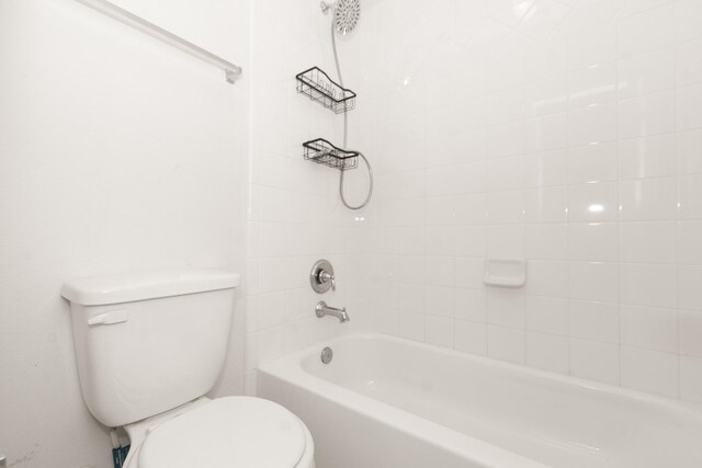 full bath with shower / tub combination and toilet