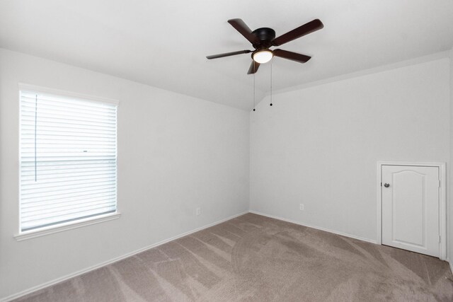 empty room featuring carpet and ceiling fan
