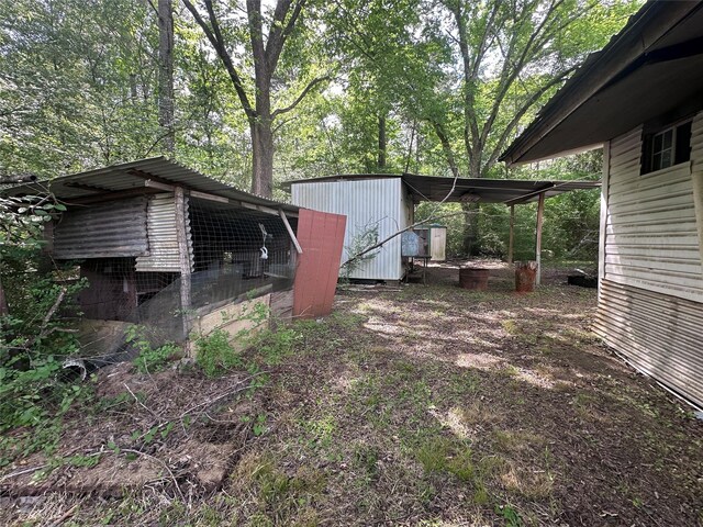 217 Box Factory Rd, Diboll, TX 75941 - view of yard featuring an outdoor structure and exterior structure