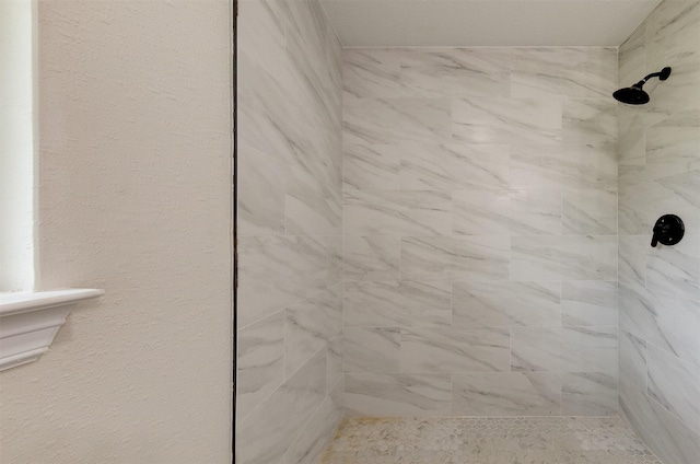 full bath featuring a tile shower