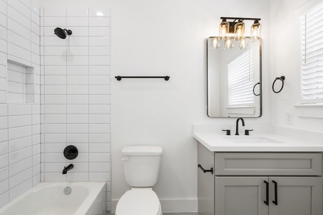 bathroom featuring shower / bathing tub combination, baseboards, vanity, and toilet