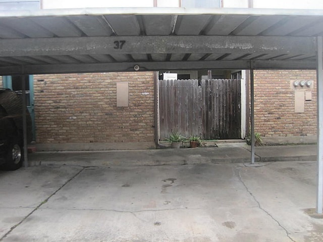 view of car parking featuring fence