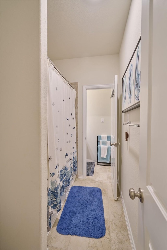 bathroom featuring curtained shower