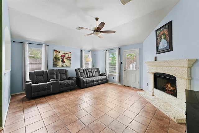 9815 Hallmark Ln, Pearland, TX 77584 - living room with ceiling fan, a fireplace, light tile patterned floors, and healthy amount of natural light
