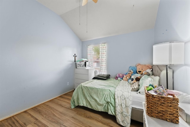 9815 Hallmark Ln, Pearland, TX 77584 - bedroom with lofted ceiling, wood finished floors, and ceiling fan