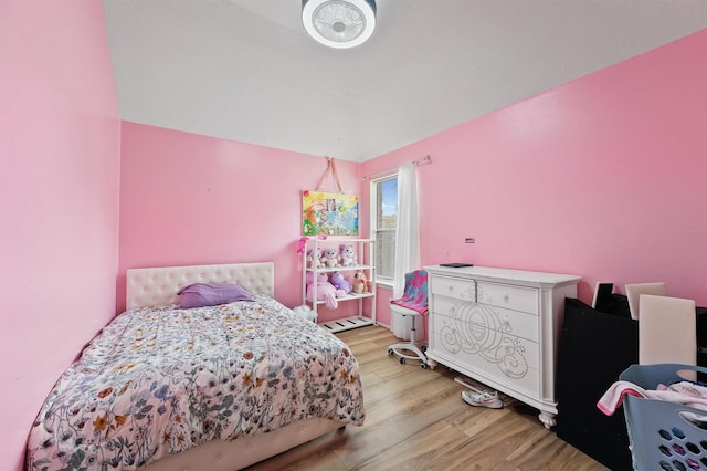 9815 Hallmark Ln, Pearland, TX 77584 - bedroom with light wood-style floors and baseboard heating