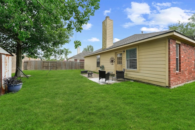 9815 Hallmark Ln, Pearland, TX 77584 - rear view of house featuring a chimney, a patio, and brick siding