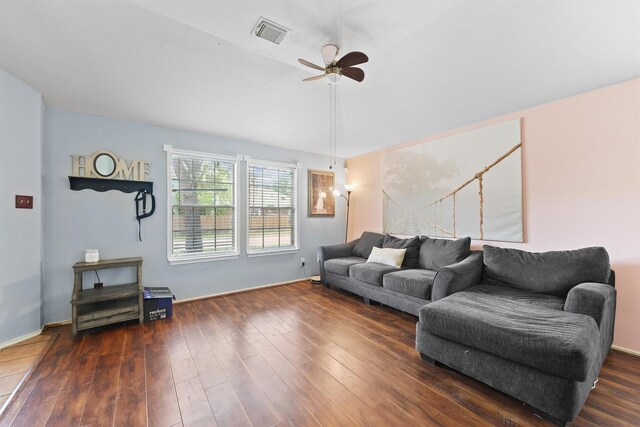 living room with visible vents, a ceiling fan, baseboards, and dark wood-style floors