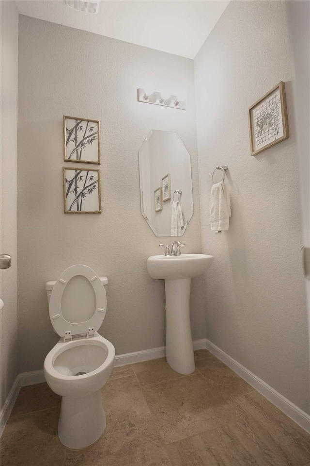 2757 Maxway Ct, League City, TX 77573 - bathroom with baseboards, toilet, and tile patterned flooring