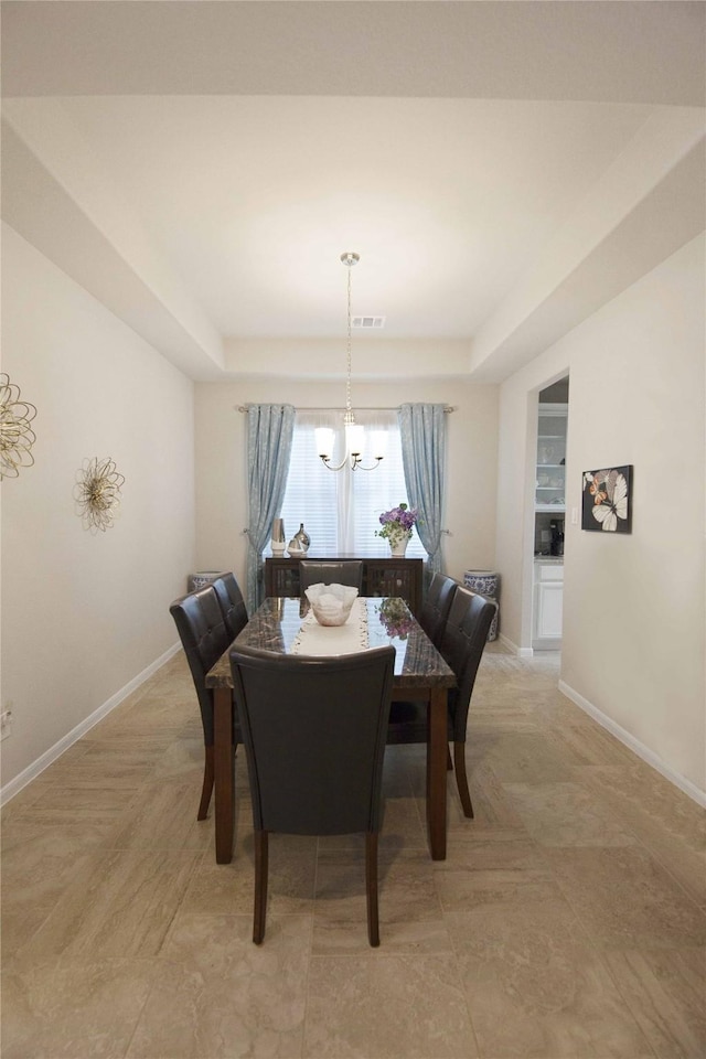 2757 Maxway Ct, League City, TX 77573 - dining area featuring a chandelier, visible vents, baseboards, and a tray ceiling