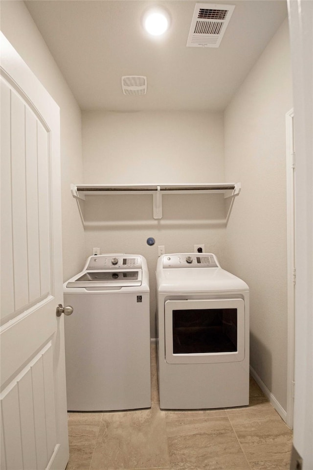 2757 Maxway Ct, League City, TX 77573 - clothes washing area featuring baseboards, visible vents, washing machine and clothes dryer, and laundry area