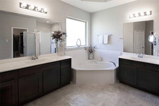 2757 Maxway Ct, League City, TX 77573 - bathroom with a garden tub, two vanities, a sink, and a shower stall