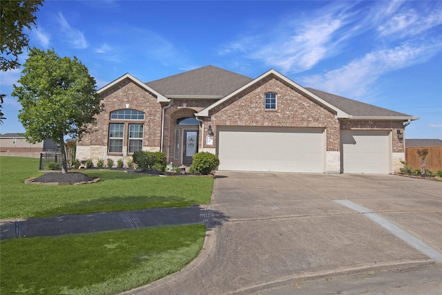 2757 Maxway Ct, League City, TX 77573 - view of front facade with a front lawn, a garage, brick siding, roof with shingles, and concrete driveway