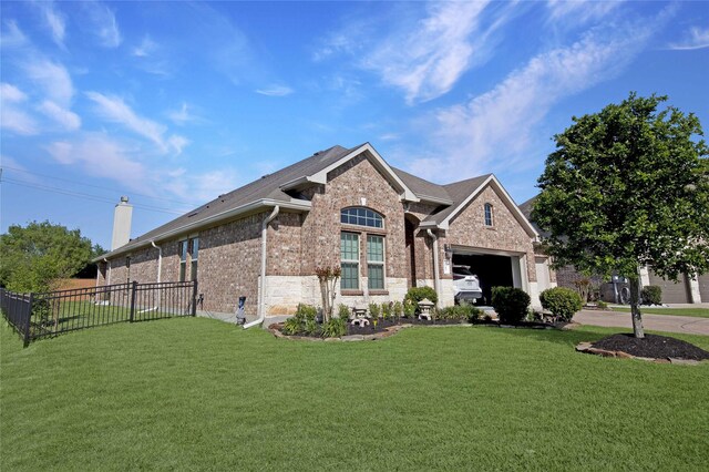 2757 Maxway Ct, League City, TX 77573 - view of front of home featuring a front yard, a garage, brick siding, a chimney, and fence