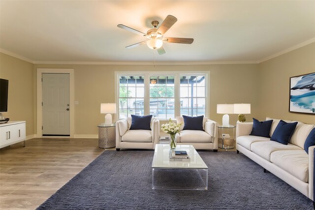 208 W Jefferson St, Trinity, TX 75862 - living area featuring ornamental molding, ceiling fan, wood finished floors, and baseboards