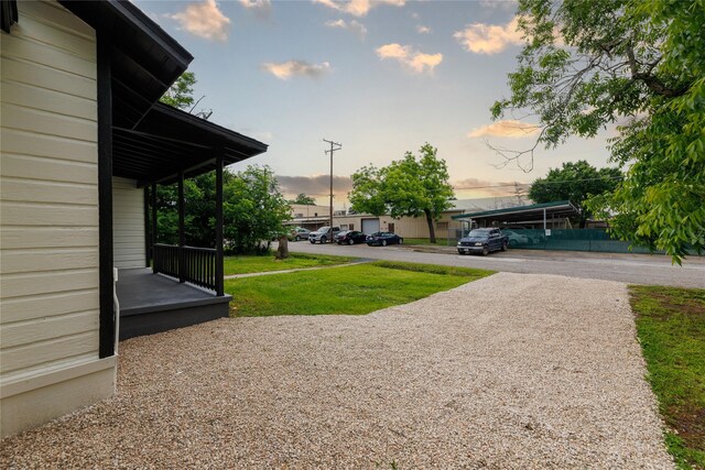 208 W Jefferson St, Trinity, TX 75862 - yard at dusk with a yard