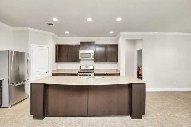 3250 Persimmon Grv, Richmond, TX 77469 - kitchen featuring ornamental molding, a sink, dark brown cabinetry, a kitchen island with sink, and appliances with stainless steel finishes