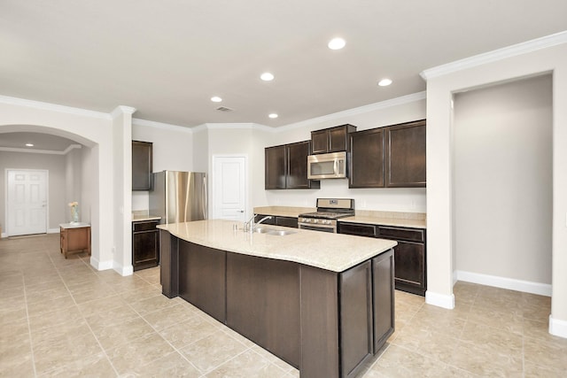 3250 Persimmon Grv, Richmond, TX 77469 - kitchen with arched walkways, crown molding, dark brown cabinets, and stainless steel appliances