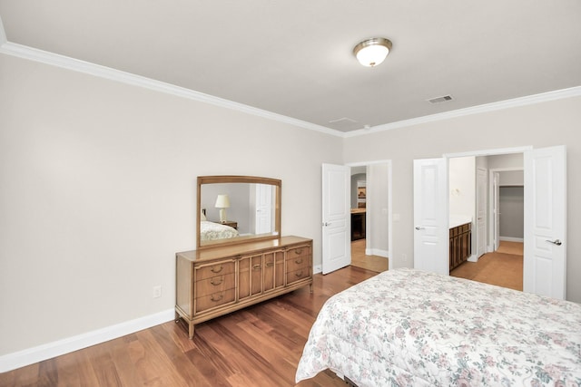 3250 Persimmon Grv, Richmond, TX 77469 - bedroom featuring baseboards, crown molding, wood finished floors, and visible vents