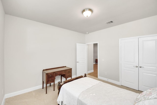 3250 Persimmon Grv, Richmond, TX 77469 - bedroom with a closet, baseboards, visible vents, and light colored carpet