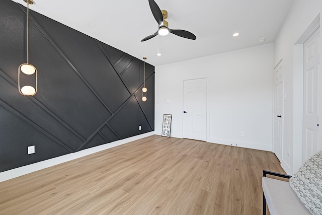 6726 Dumble St, Houston, TX 77021 - unfurnished bedroom with light wood-type flooring, baseboards, ceiling fan, and recessed lighting
