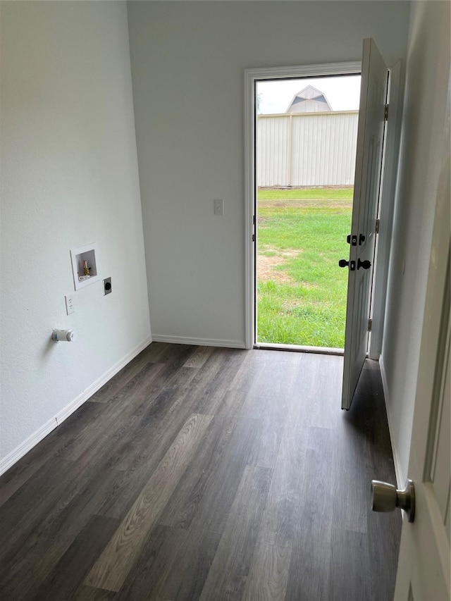 laundry room featuring laundry area, dark wood-type flooring, hookup for a washing machine, baseboards, and electric dryer hookup
