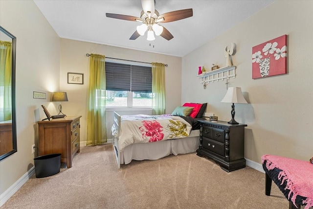 carpeted bedroom with baseboards and ceiling fan