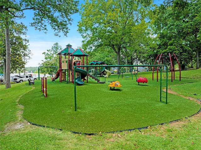 community jungle gym with a yard