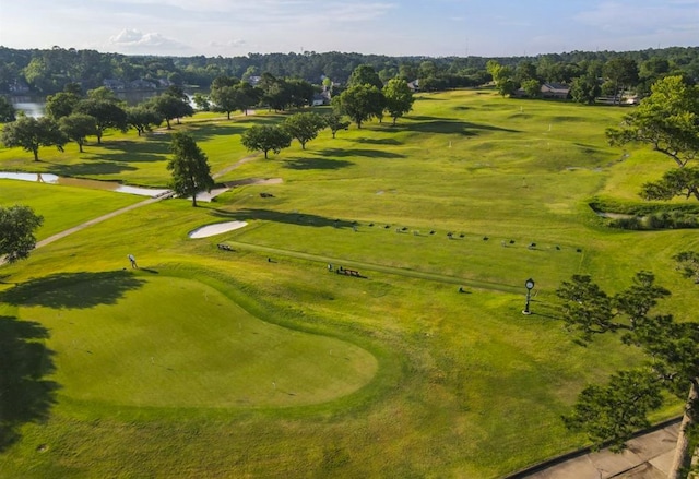 surrounding community with view of golf course
