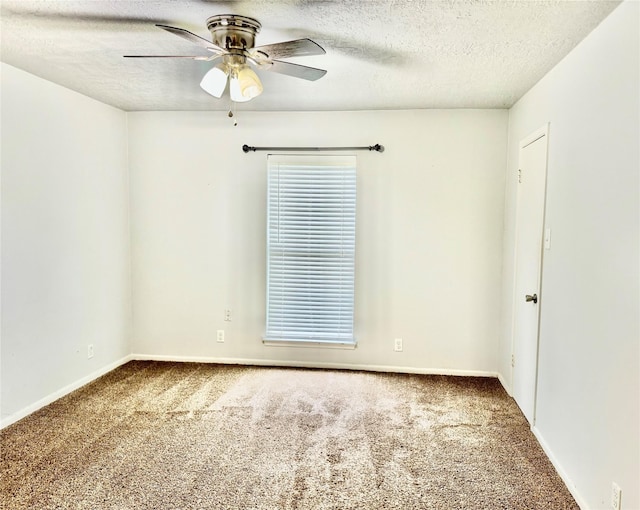 200 Greenwood Dr, Beaumont, TX 77705 - spare room with ceiling fan, baseboards, a textured ceiling, and carpet