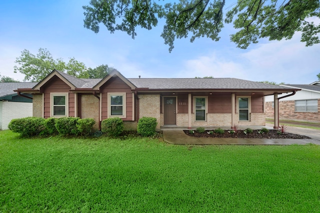 1111 Robert St, Pearland, TX 77581 - ranch-style home with brick siding, a front lawn, and roof with shingles