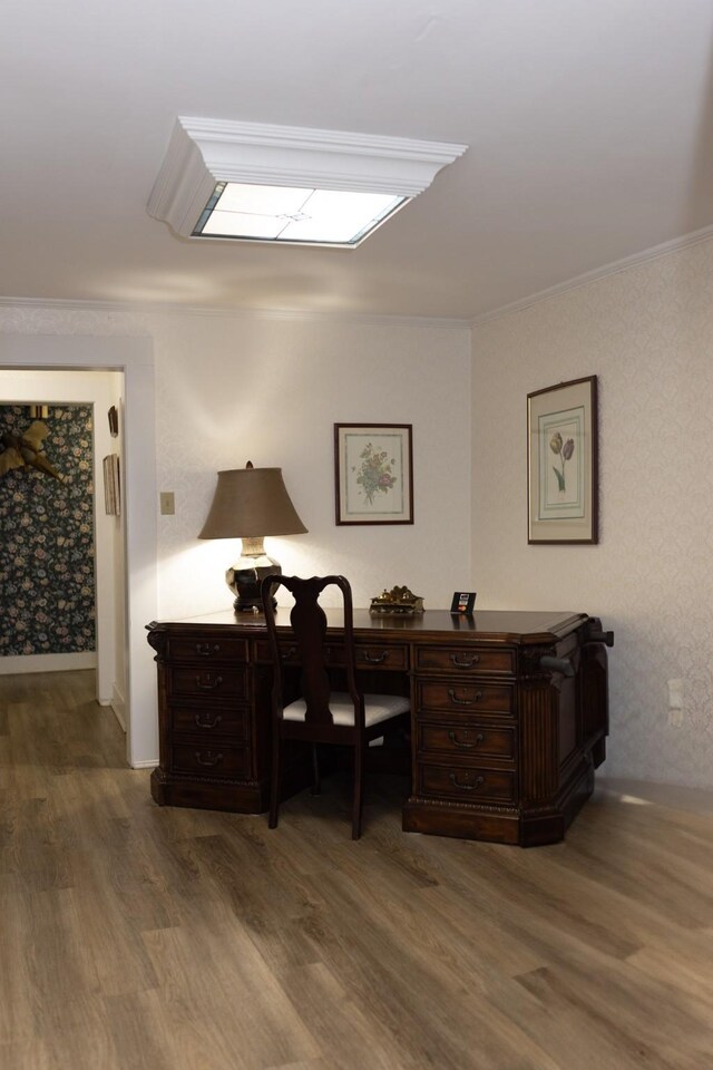 home office with ornamental molding and wood finished floors