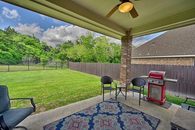 view of patio / terrace with a ceiling fan, a fenced backyard, and area for grilling