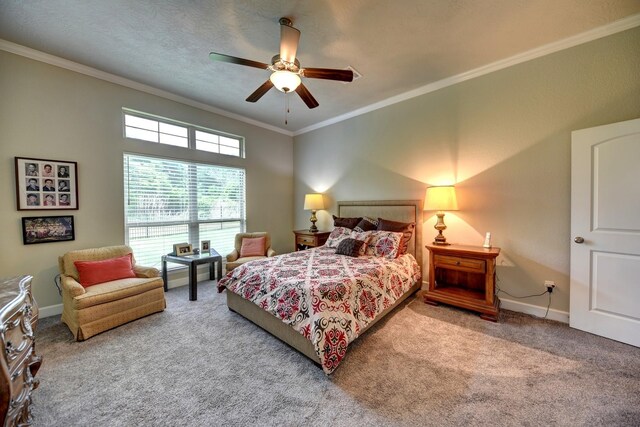 bedroom featuring ceiling fan, carpet, baseboards, and ornamental molding