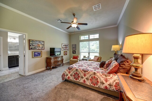 bedroom with light colored carpet, crown molding, and visible vents