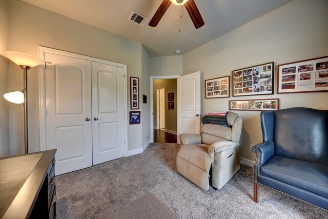 sitting room featuring visible vents, baseboards, carpet flooring, and ceiling fan