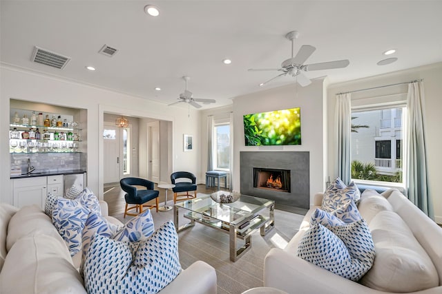 living area with visible vents, recessed lighting, and a wealth of natural light