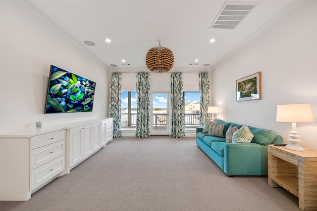 living room featuring light carpet, recessed lighting, and visible vents