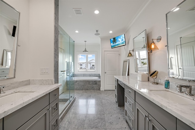full bathroom with a garden tub, visible vents, a shower stall, a sink, and ornamental molding