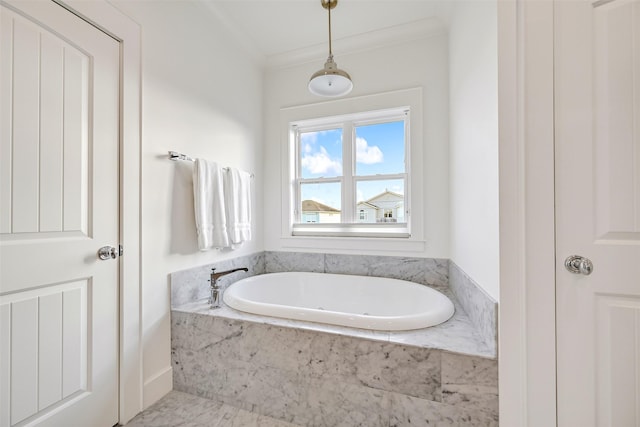 full bathroom with crown molding and a garden tub
