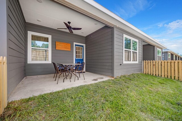 exterior space featuring fence and ceiling fan