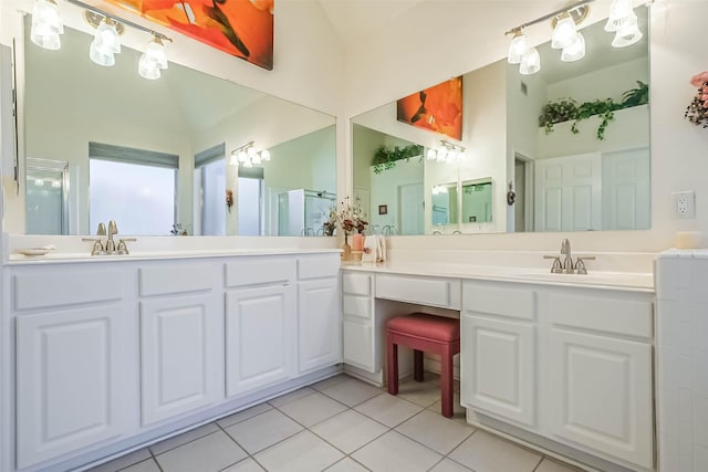 full bathroom with tile patterned flooring, a sink, double vanity, and a stall shower