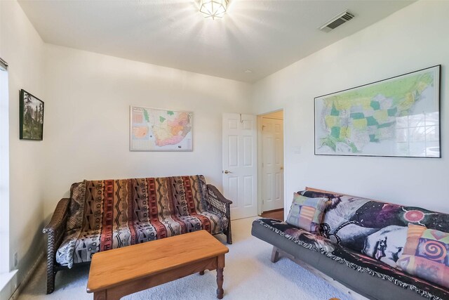 living area with carpet floors and visible vents