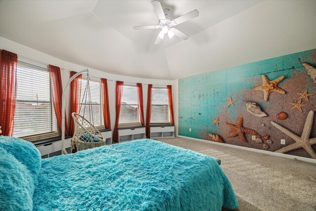 bedroom featuring vaulted ceiling, multiple windows, carpet flooring, and ceiling fan
