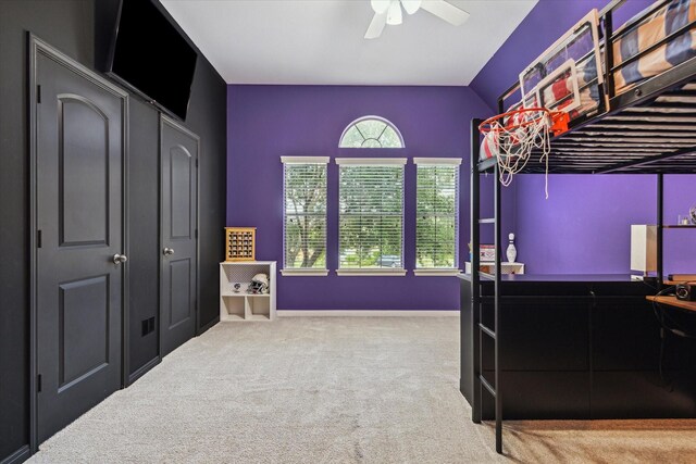 bedroom with vaulted ceiling, baseboards, ceiling fan, and carpet flooring