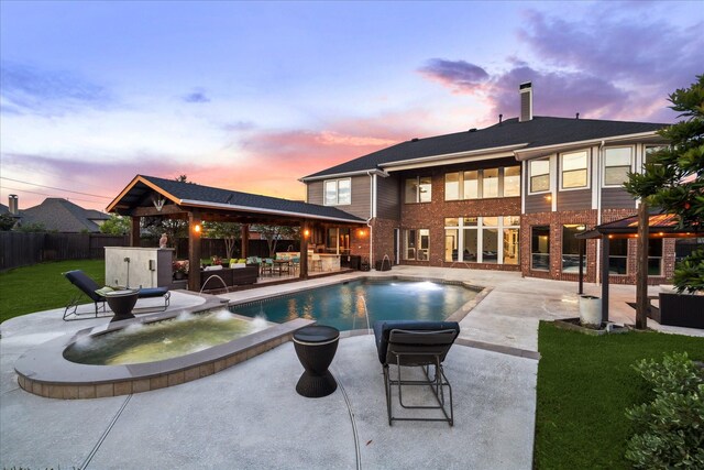pool at dusk featuring fence, an outdoor hangout area, a fenced in pool, a patio area, and a gazebo