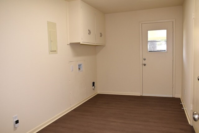 laundry room with cabinet space, dark wood finished floors, washer hookup, and baseboards