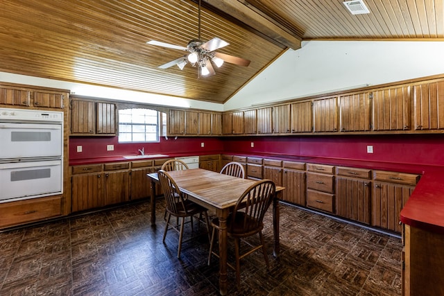dining room featuring wood ceiling, visible vents, ceiling fan, and vaulted ceiling with beams